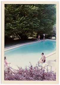 A colour photograph of the swimming pool at the Marysville Hotel in Marysville. The photograph is of a group of unknown guests enjoying the pool.