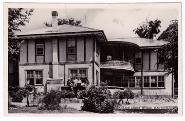 A black and white postcard from Kerami Guest House in Marysville. This postcard was produced by Valentine Publishing Co. Pty. Ltd. as a souvenir of Marysville. On the reverse of the postcard is a space to write a message and an address and to place a postage stamp. The postcard is unused.