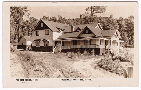 A black and white postcard from Kooringa Guesthouse in Marysville. The original house was built in 1914 for Frederick Webb by the Cuzens Brothers. The postcard was produced by "The Rose Stereographs" as a souvenir of Marysville. On the reverse of the postcard is a space to write a message and an address and to place a postage stamp. The postcard is unused.