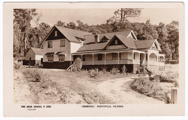 A black and white postcard from Kooringa Guesthouse in Marysville. The original house was built in 1914 for Frederick Webb by the Cuzens Brothers. The postcard was produced by "The Rose Stereographs" as a souvenir of Marysville. On the reverse of the postcard is a space to write a message and an address and to place a postage stamp. The postcard is unused.