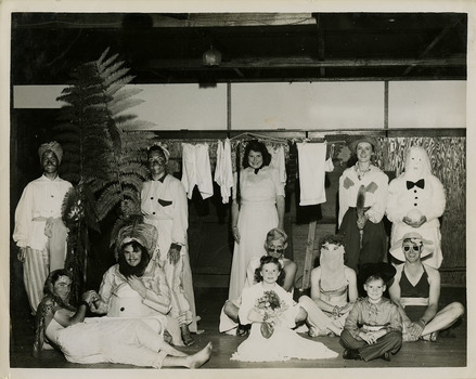A black and white photograph taken during a New Year's Eve fancy dress party at Kooringa Guest House in Marysville. The photograph is of an unknown group of people and was taken at the end of 1946.