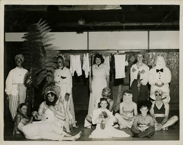 A black and white photograph taken during a New Year's Eve fancy dress party at Kooringa Guest House in Marysville. The photograph is of an unknown group of people and was taken at the end of 1946.