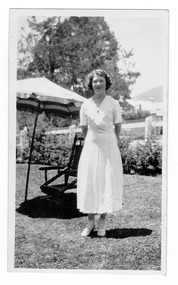 A digital copy of a black and white photograph of an unknown lady at Kooringa Guest House in Marysville.