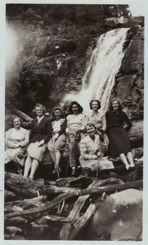 A copy of a black and white photograph of an unknown group of guests staying at Kooringa Guest House in Marysville on a visit to Steavenson Falls in Marysville. The original photograph was taken in 1947.