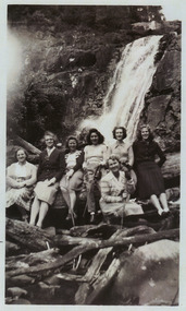 A copy of a black and white photograph of an unknown group of guests staying at Kooringa Guest House in Marysville on a visit to Steavenson Falls in Marysville. The original photograph was taken in 1947.