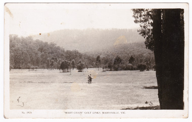 A black and white postcard from the Mary Chain Golf Links in Marysville. The Mary Chain Golf Links were linked to the Mary Chain guesthouses and were also built by Eric Dowdle. The postcard was produced by the Rose Stereograph Company as souvenir of Marysville. On the reverse of the postcard is a space to write a message and an address and to place a postage stamp. The postcard is unused.