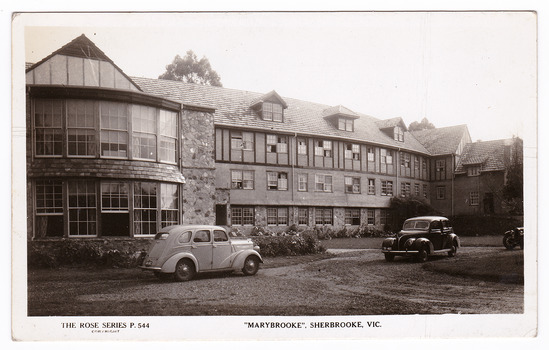 A black and white postcard of Marybrooke guest house in Sherbrooke. Marybrooke was part of the Mary Chain of guest houses built by Eric Dowdle during the Depression years. The postcard was produced by the Rose Stereograph Company as a souvenir of Sherbrooke. On the reverse of the postcard is a space to write a message and an address and to place a postage stamp. The postcard is unused.