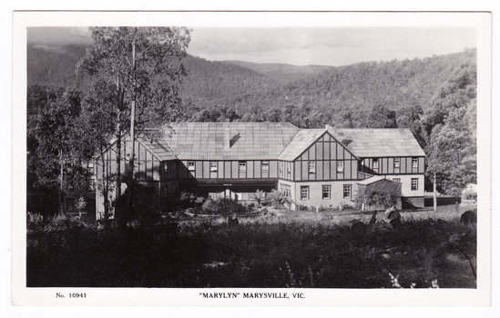 A black and white postcard from Marylyn Guest House in Marysville. Marylyn was a part of the Mary Chain of guest houses built by Eric Dowdle in the Depression years. The postcard was produced by the Rose Stereograph Company as a souvenir of Marysville. On the reverse is a hand-written message.