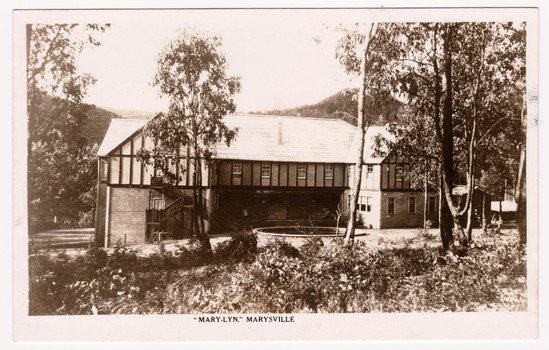 A black and white postcard from Marylyn Guest House in Marysville. Marylyn was a part of the Mary Chain of guest houses built by Eric Dowdle in the Depression years. The postcard was produced by the Rose Stereograph Company as a souvenir of Marysville. On the reverse is a hand-written message.