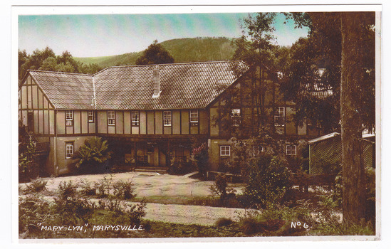 A colour photograph of a postcard from Mary-Lyn Guest House in Marysville. Mary-Lyn was a part of the Mary Chain of guest houses built by Eric Dowdle in the Depression years. The original postcard was produced by Valentine Publishing Co Pty. Ltd. as a souvenir of Marysville.