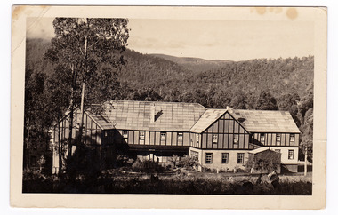 A black and white postcard from Mary-Lyn Guest House in Marysville. Mary-Lyn was a part of the Mary Chain of guest houses built by Eric Dowdle in the Depression years. The postcard was produced by Kodak as a souvenir of Marysville and was sent on 5th April 1938. On the reverse of the postcard is a handwritten message.