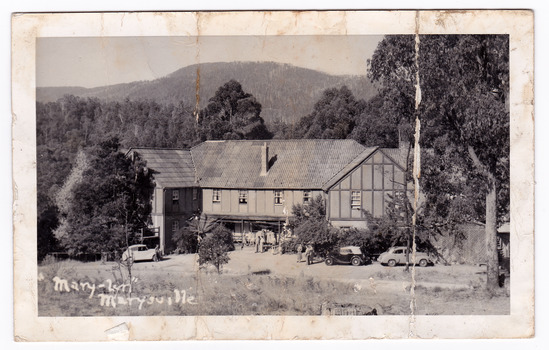 A black and white postcard from Mary-Lyn Guest House in Marysville. Mary-Lyn was a part of the Mary Chain of guest houses built by Eric Dowdle in the Depression years. The postcard was produced by Kodak as a souvenir of Marysville. On the reverse is a handwritten message.