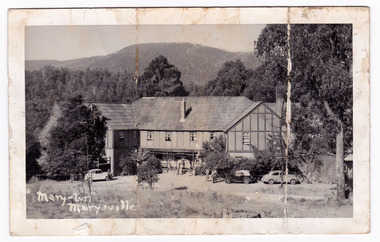 A black and white postcard from Mary-Lyn Guest House in Marysville. Mary-Lyn was a part of the Mary Chain of guest houses built by Eric Dowdle in the Depression years. The postcard was produced by Kodak as a souvenir of Marysville. On the reverse is a handwritten message.