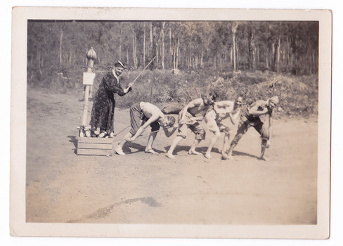 A black and white photograph of a group of guests who were staying at Mary-Lyn Guest House in Marysville. Mary-Lyn was a part of the Mary Chain of guest houses built by Eric Dowdle in the Depression years. The photograph shows a group of five men acting out a skit at an unknown location.
