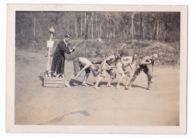 A black and white photograph of a group of guests who were staying at Mary-Lyn Guest House in Marysville. Mary-Lyn was a part of the Mary Chain of guest houses built by Eric Dowdle in the Depression years. The photograph shows a group of five men acting out a skit at an unknown location.