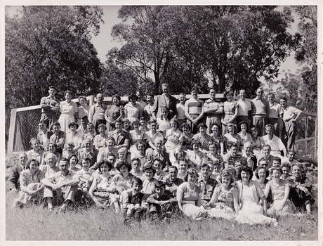 A black and white photograph taken at Mary-Lyn Guest House in Marysville. Mary-Lyn was part of the Mary Chain of guest houses built by Eric Dowdle in the Depression years. The photograph is of the staff and guests staying at Mary-Lyn at some time in 1948.