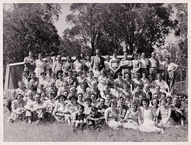 A black and white photograph taken at Mary-Lyn Guest House in Marysville. Mary-Lyn was part of the Mary Chain of guest houses built by Eric Dowdle in the Depression years. The photograph is of the staff and guests staying at Mary-Lyn at some time in 1948.