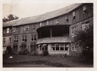 A black and white photograph taken at Mary-Lyn Guest House in Marysville. Mary-Lyn was a part of the Mary Chain of guest houses built by Eric Dowdle in the Depression years. The photograph is of the front of the main building and was taken in February 1949.