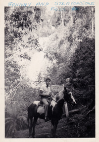 A black and white photograph of a guest who was staying at Mary-Lyn Guest House in Marysville. Mary-Lyn was a part of the Mary Chain of guest houses built by Eric Dowdle in the Depression years. The photograph is of a man on horseback at Steavensons Falls in Marysville.