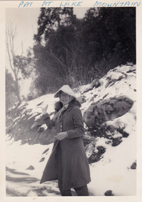 A black and white photograph of a guest who was staying at Mary-Lyn Guest House in Marysville. Mary-Lyn was a part of the Mary Chain of guest houses built by Eric Dowdle in the Depression years. The photograph is of a lady in the snow at Lake Mountain.