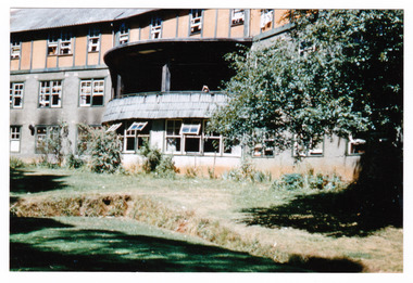 A copy of a colour photograph of Mary-Lyn Guest House in Marysville. Mary-Lyn was a part of the Mary Chain of guest houses built by Eric Dowdle in the Depression years. The photograph was taken in January 1959 and shows the croquet lawn in the foreground.