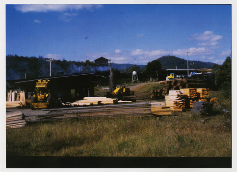 A copy of a colour photograph taken at Sunds Bros Sawmill located in Marysville. The original photograph was taken in the 1970s. Sund's Sawmill (historically operated by Arthur & John Sund and often referenced locally as Sund Stenco) was a prominent mid-century timber mill located in Marysville, Victoria. It played a central role in the region's booming post-war logging era. 