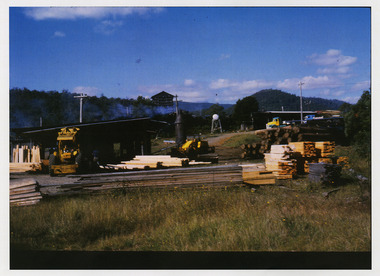 A copy of a colour photograph taken at Sunds Bros Sawmill located in Marysville. The original photograph was taken in the 1970s. Sund's Sawmill (historically operated by Arthur & John Sund and often referenced locally as Sund Stenco) was a prominent mid-century timber mill located in Marysville, Victoria. It played a central role in the region's booming post-war logging era. 