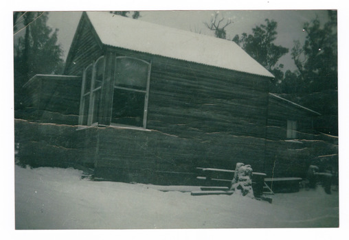A copy of a black and white photograph of the Wilks Creek State School. The Wilks Creek State School was established, primarily, to educate the timber mill workers' children.
