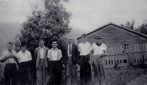 A copy of a black and white photograph of some of the workers at the Andersons No. 1 Mill near Marysville. The original photograph was taken in 1942 whilst the men were on a working bee collecting firewood for the Wilks Creeks State School.