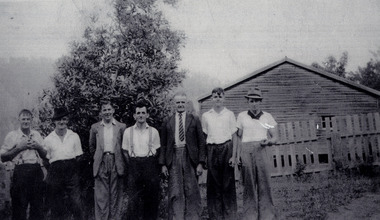 A copy of a black and white photograph of some of the workers at the Andersons No. 1 Mill near Marysville. The original photograph was taken in 1942 whilst the men were on a working bee collecting firewood for the Wilks Creeks State School.