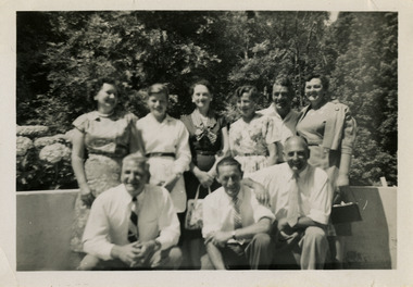 A black and white photograph of a group of men and ladies. Two of the men in the photograph worked at timber mills near Marysville.