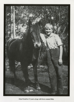 A copy of a black and white photograph of Lloyd Gould, aged 13, with a horse named Kitty.
