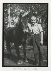 A copy of a black and white photograph of Lloyd Gould, aged 13, with a horse named Kitty.