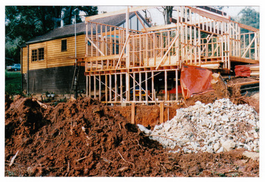 Shows a photograph taken during the construction of Abor Green cottages in Marysville.