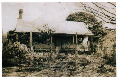 A black and white photograph of Cloverdale near Marysville in Victoria. Shows a weatherboard home with a verandah running along the front.