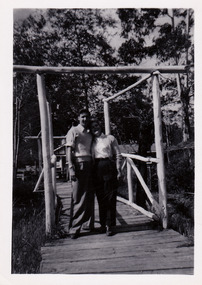 A black and white photograph of the wooden bridge at the Fruit Salad Farm in Marysville that was taken in November 1956.