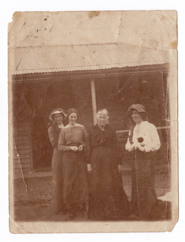 A digital copy of a black and white photograph of Bridget Kirwan and three unknown younger women.