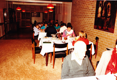 A digital copy of a colour photograph of diners eating dinner at Mountain Lodge in 1985.