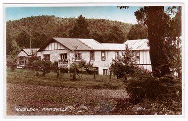 A colour tinted postcard of Roseleigh Guest House in Marysville that was produced by Valentine Publishing Co. Pty Ltd as a souvenir of Marysville.