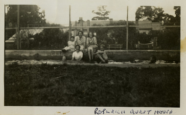 A black and white photograph of an unknown group of people at the swimming pool at Roseleigh in Marysville. The photograph was taken in 1954.