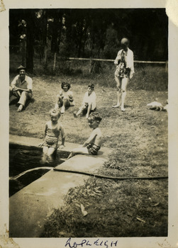 A black and white photograph of an unknown group of people at the swimming pool at Roseleigh in Marysville. The photograph was taken in 1954.