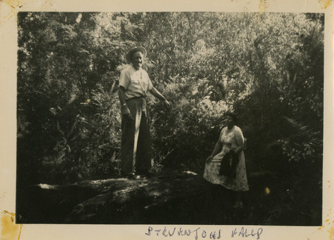 A black and white photograph of an unknown man and woman at Steavenson Falls in Marysville. The photograph was taken in 1954 during a stay at Roseleigh in Marysville.