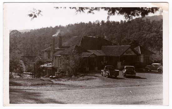 A black and white postcard from the Australian Hotel in Marysville that was produced by the Rose Stereograph Company as a souvenir of Marysville. The hotel was originally built and opened by the Keppel Family in 1865. The Keppel's Australian Hotel was the first hotel to be opened in Marysville. The Keppel Family were among Marysville's earliest pioneering families. On the reverse of the postcard is a space to write a message and an address and to place a postage stamp. The postcard is unused.