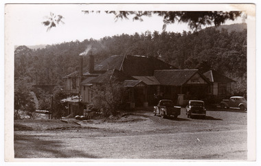 A black and white postcard from the Australian Hotel in Marysville that was produced by the Rose Stereograph Company as a souvenir of Marysville. The hotel was originally built and opened by the Keppel Family in 1865. The Keppel's Australian Hotel was the first hotel to be opened in Marysville. The Keppel Family were among Marysville's earliest pioneering families. On the reverse of the postcard is a space to write a message and an address and to place a postage stamp. The postcard is unused.