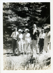 A digital copy of a black and white photograph of a Doctor Harrison and his family taken at Kerami guest house in Marysville.