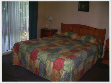 A colour photograph taken at Kerami Gardens Resort in Marysville. The photograph is of one of the guest bedrooms at the resort.