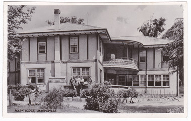 A black and white postcard from Mary Lodge Guest House in Marysville. The postcard was produced by Valentine Publishing Co. Pty. Ltd. as a souvenir of Marysville. On the reverse of the postcard is a hand written message.