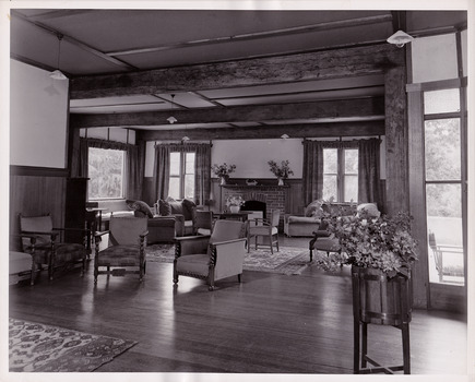 A black and white photograph taken at Mary Lodge Guest House in Marysville. The photograph is of the indoor lounge area in the guest house.