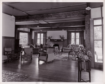 A black and white photograph taken at Mary Lodge Guest House in Marysville. The photograph is of the indoor lounge area in the guest house.