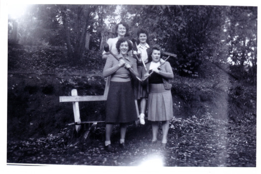A black and white photograph taken at Mary Lodge Guest House in Marysville. The photograph was taken of an unknown group of people during a croquet game at Mary Lodge in April 1944.wfall in April 1944.